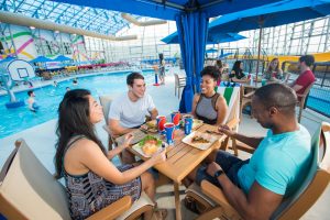 Family Enjoying Dinner In Cabana